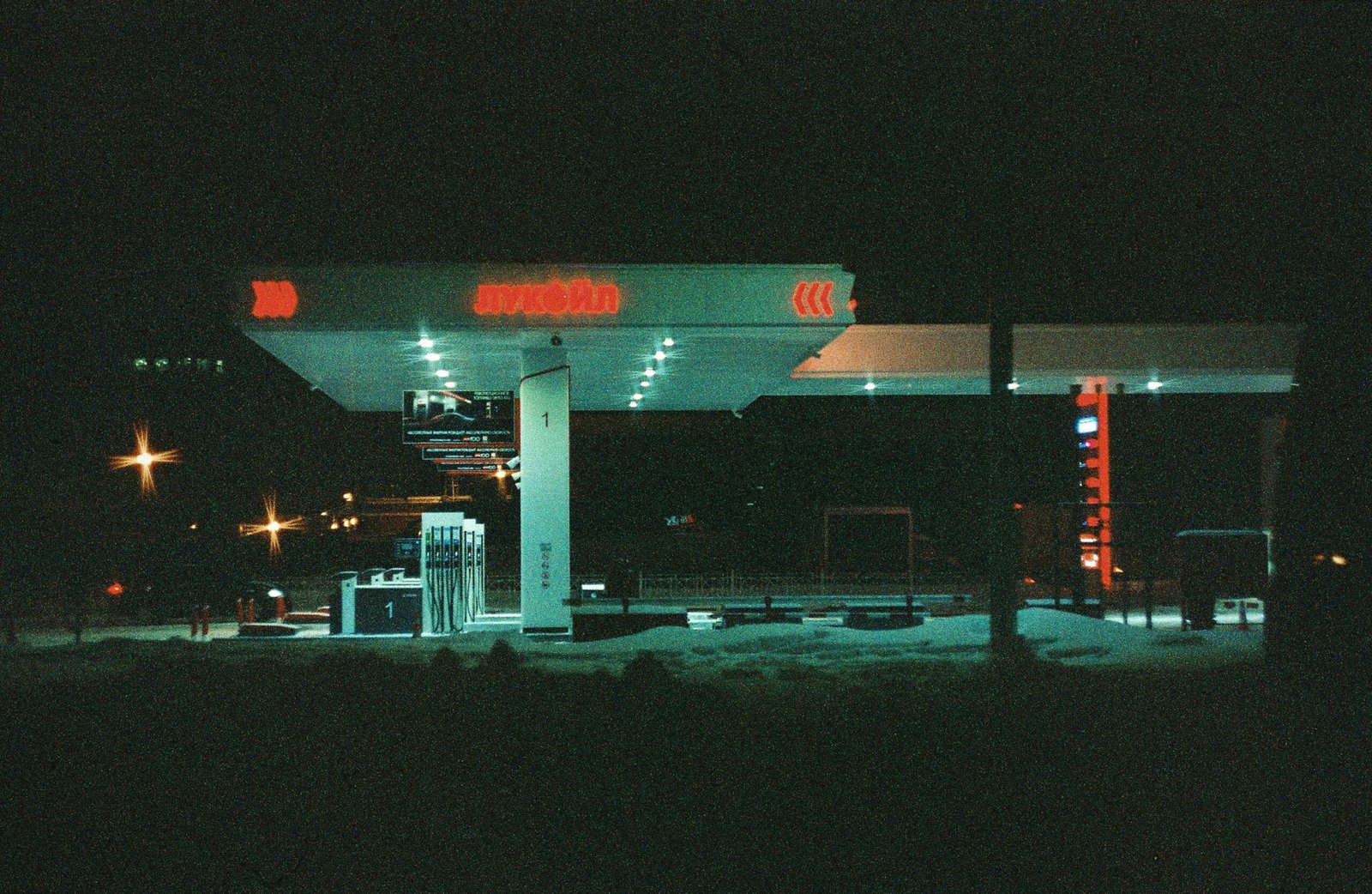 Atmospheric night view of an illuminated gas station in Saint Petersburg, Russia.